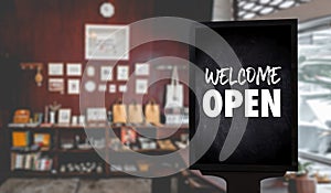 Come in WeÃ¢â¬â¢re OpenÃ¢â¬â¢ on cafe waiter standing in front of coffee shop vintage retro sign